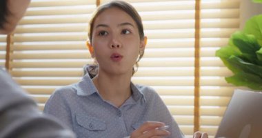 Smart Gen Z tech talent workforce young two people asia woman happy work at office. Small group asian leader team talk sharing idea give advice consult project plan in data engineer career job mentor.