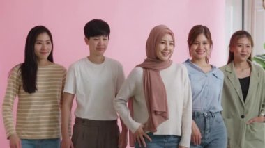 Group of young people Gen Z talent workforce relax smile look at camera standing studio shot shooting. Power of diverse asia girl woman, youth LGBT gay lesbian, islam female lady unity in women's day.