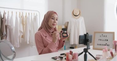 Islam youtuber arab influencer vlogger or beauty blogger live smile talk on social media vlog instagram. Show share selfie video sale online on small shop trendy job for asia people Gen Z young girl.