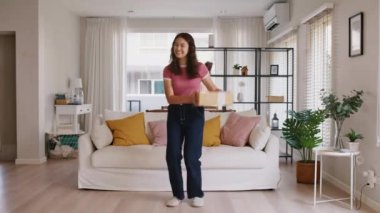 Asia people young Gen Z woman smile carry parcel box goods carton packaging happy joy fun dance at home. Omni channel enjoy buy gift order postal at retail online shop store fast courier send service.