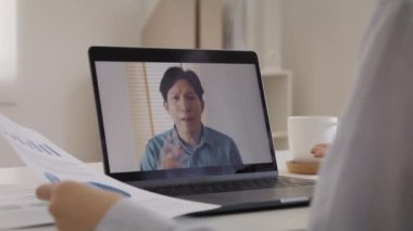 Bad boss video call work argue point face stress rude yelling anger hate speech at male coworker. Two asia people man woman fight on laptop meeting at office upset mad bossy worker. Career job issue.