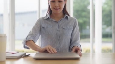 Fully remote job career in young Gen Z smart tech talent workforce. Asia people woman happy easy relax open laptop start work anywhere at share office hybrid workplace study MBA reskill upskill course