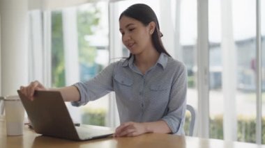 Fully remote job career in young Gen Z smart tech talent workforce. Asia people woman happy easy relax open laptop start work anywhere at share office hybrid workplace study MBA reskill upskill course