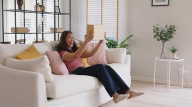 Asia people young woman smile love hug parcel box goods carton packaging happy joy awe face at home. Omni channel enjoy buy gift order postal at retail online shop store fast courier sending service.