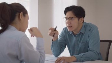 Bad CEO boss work argue point face stress rude yelling anger hate speech at female coworker. Two adult asia people man woman fight on meeting at office upset mad bossy male worker. Career job issue.