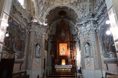 Biar, Alicante, Spain, January 14, 2023: Main altar and decoration of the Churrigueresque style Communion Chapel inside the church of Our Lady of the Assumption of Biar, Alicante, Spain