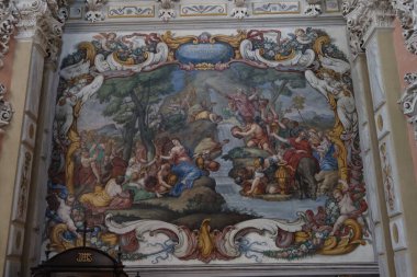 Biar, Alicante, Spain, January 14, 2023: Painting on the right side wall of the Churrigueresque style Communion Chapel inside the church of Our Lady of the Assumption of Biar, Alicante, Spain