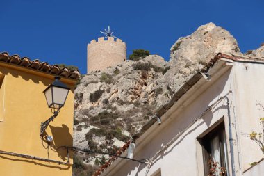 Castalla, Alicante, Spain, February 3, 2023: View of the tower of the Arab castle of Castalla, Alicante, Spain