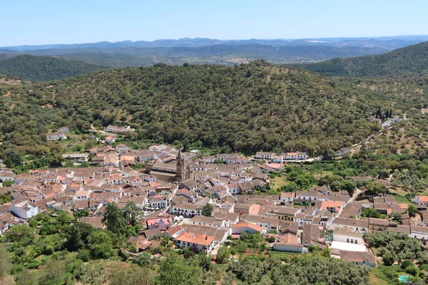 stock image Alajar, Huelva, Spain, April 23, 2023: General view between mountains of the white village of Alajar, Huelva, Spain