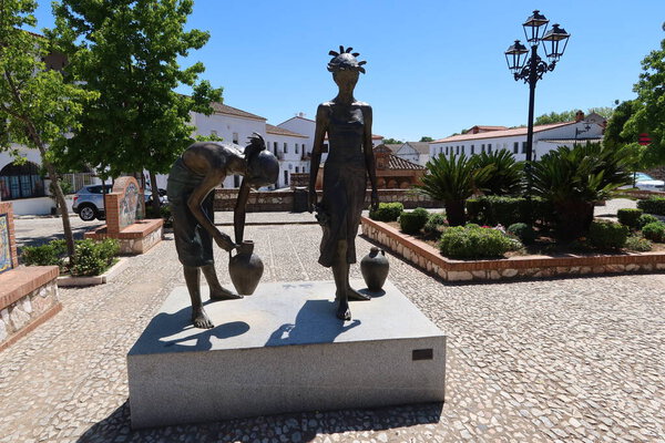 Aracena, Huelva, Spain, May 11, 2023: Monument to the water carriers next to the Fuente del concejo, old public laundry. Aracena, Huelva, Spain
