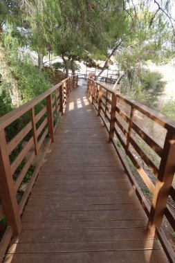 Rojales, Alicante, Spain, October 31, 2024: Wooden walkway of the Rodeo Caves, Rojales, Alicante, Spain clipart