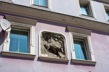 A statue of wolf in Klodzko, Poland, depicting intricate craftsmanship and artistic expression, standing as a testament to the town's rich cultural heritage. clipart