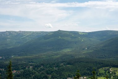 Views from Wysoki Kamien peak at 1058m in the Jizera Mountains reveal breathtaking landscapes of rolling hills. clipart