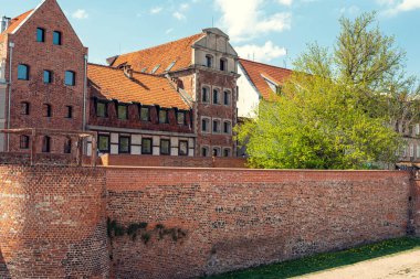 Medieval city walls of Torun, Poland, showcasing well-preserved fortifications and historical architecture from the Middle Ages. clipart