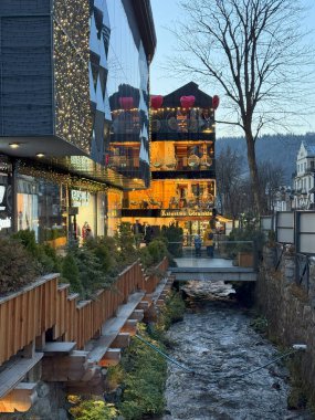 The unique architecture of Zakopane, a picturesque town at the foot of the Tatra Mountains, Poland, known for its wooden houses and alpine style clipart