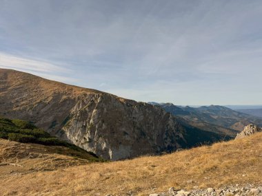 Panoramic views from Mount Giewont, Tatra Mountains, Poland, revealing sweeping landscapes and majestic peaks clipart