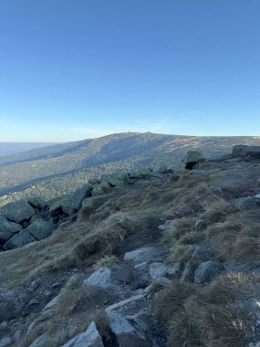 From Szrenica peak in the Karkonosze, sweeping views of valleys and mountains unfold across the stunning landscape clipart