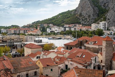 View over the historic town of Omis from Peovica Fortress, Croatia, capturing stunning Adriatic coastal scenery. clipart