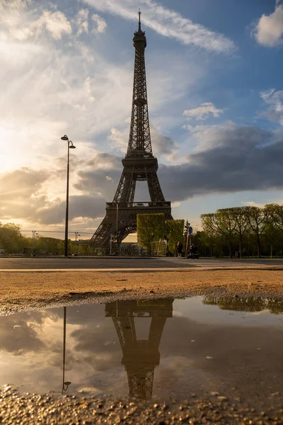 Beautiful view of Tour Eiffel isolated reflected in a puddle at sunset, Paris, France