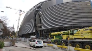 Santiago Bernabeu. Exterior of the Santiago Bernabu stadium in full works and renovation of the venue where Real Madrid C.F. Football field. Field full of machines.