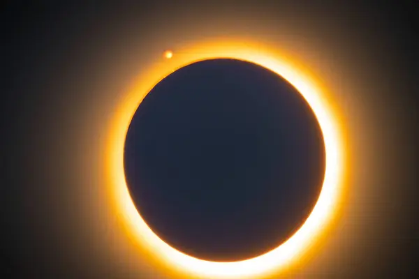 Solar eclipse. Eclipse with ring of fire due to the moon coming between the Earth and the sun. Solar eclipse on April 8, 2024. Solar Eclipse of the Sun on a Cloudy Day. Close-up