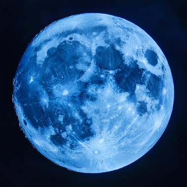 Blue Moon. Cold moon. Full moon. Super full moon. 15 December 2024. Super full moon with dark background. Moon. Supermoon. Blue super moon glowing with blue halo surrounded by small stars on black sky background.
