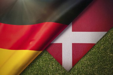 Almanya. Danimarka. Almanya bayrağı. Danimarka bayrağı. İkisinin de sahip olduğu parti çatışmasından dolayı birleşik bayraklar. Futbol maçı. Avrupai. Avro. 2024. UEFA Avrupa Şampiyonası.