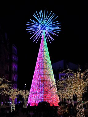 Christmas. Lights. Christmas lights through the streets of Vigo. Decorating streets of the city. Fir tree with Christmas lights. Christmas ball. On. VIGO. SPAIN. 28 December 2024. clipart