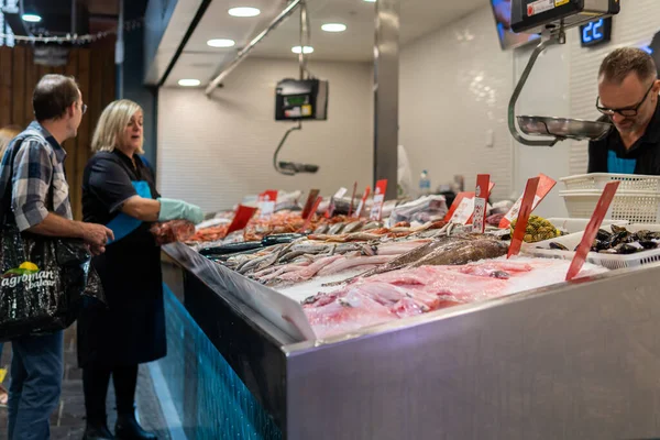 stock image Inca, Spain; october 22 2022: Interior of the Municipal Market in the Mallorcan town of Inca, with customers shopping at the meat and fresh fish stalls