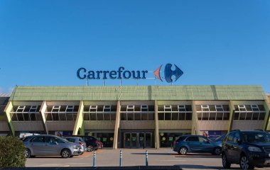 Sa Coma, Spain; february 17 2023: Main facade of the multinational hypermarket company Carrefour, in the Majorcan town of Sa Coma, Spain