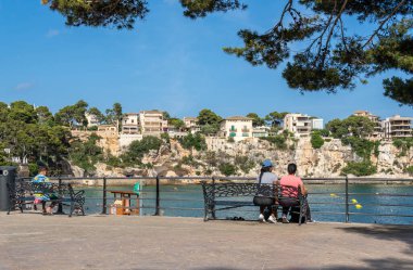 Porto Cristo, Spain; july 01 2023: General view of the promenade of the tourist town of Porto Cristo in summer. Island of Mallorca, Spain clipart