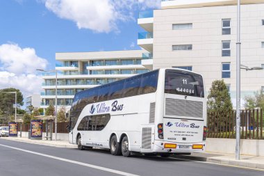 Palma de Mallorca, Spain; may 08 2024: Ultra Bus tourist bus parked in front of a modern luxury hotel in the tourist resort of Playa de Palma, Majorca clipart