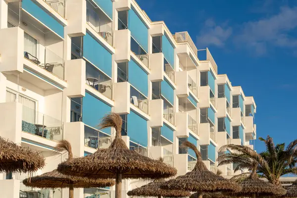 stock image Facade with balconies of a hotel in a tourist area of the island of Mallorca at sunset. Balearic Islands, Spain