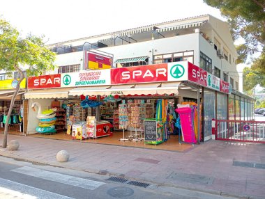 Palmanova, Spain; august 10 2024: Facade of a souvenir shop in the Majorcan tourist resort of Palmanova, on a sunny summer day clipart