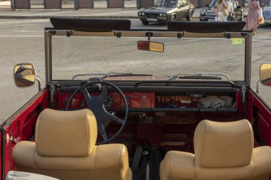 Felanitx, Spain; october 20 2024: Garnet-colored Volkswagen Safari convertible classic car at the exhibition of classic cars at the paprika fair in the Majorcan town of Felanitx clipart