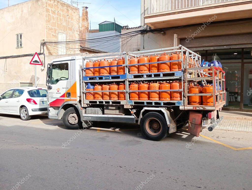 Felanitx, Spain; january 22 2025: Delivery truck and sale of orange butane cylinders, in the Majorcan town of Felanitx, Spain