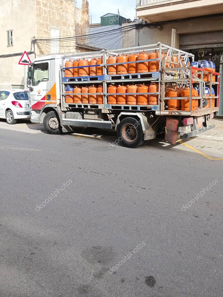 Felanitx, Spain; january 22 2025: Delivery truck and sale of orange butane cylinders, in the Majorcan town of Felanitx, Spain