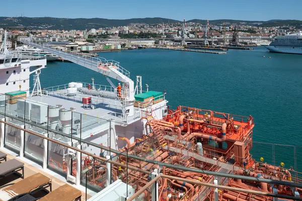 stock image Tanker supplies cruise ship with liquefied Natural Gas (LNG) or clean energy with fewer emissions in the port of Trieste, Italy.