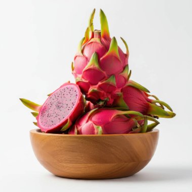 Exotic dragon fruit cubes showcased attractively in a wooden bowl atop white surface clipart