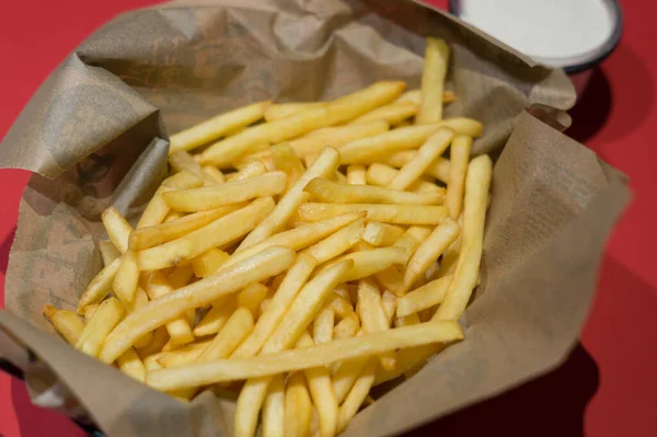 stock image Plate of french fries. Paper cone or paper bag with chips. 