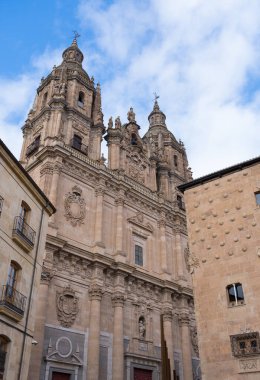 Building of the former Real Colegio del Espritu Santo named La Clerecia in Salamanca (Castile and Leon, Spain). Historic building in baroque style. Church with an impressive facade of three bodies.