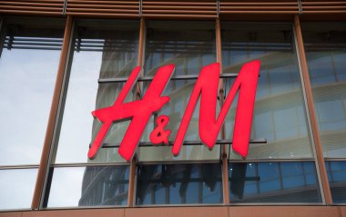 HM shop sign. HM shop logo on the facade of a building.