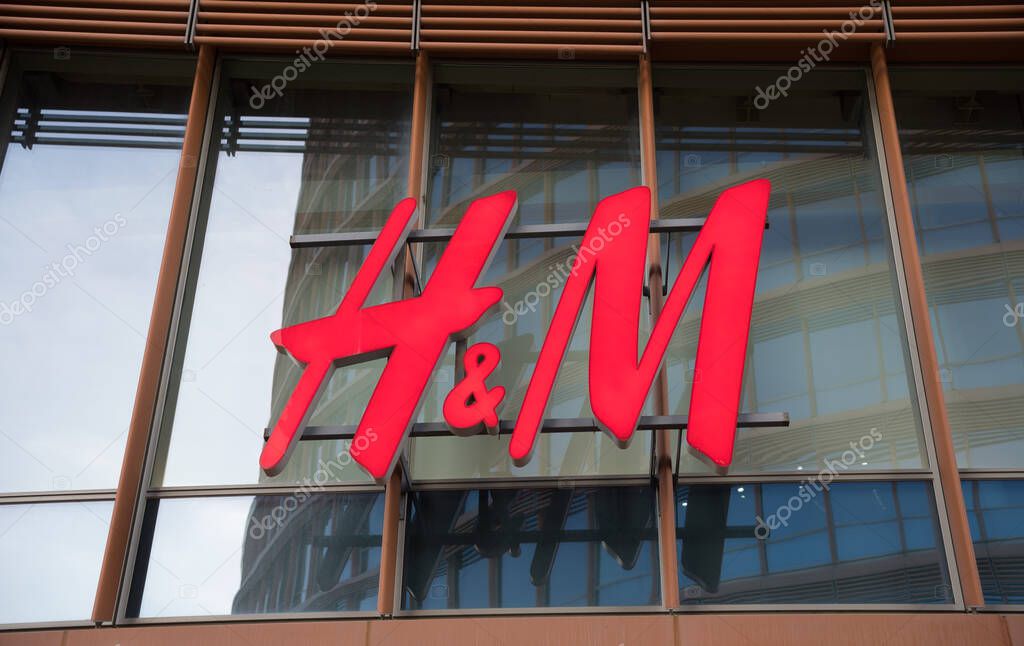 HM shop sign. HM shop logo on the facade of a building.