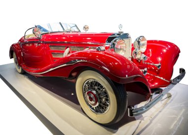 Stuttgart, Germany - December 13, 2017: Right view - Vintage Mercedes-Benz 500K Special-Roadster in the Mercedes-Benz Museum. Model 1936 year clipart