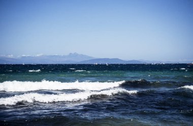 sea summer landscape. Mediterranean sea with waves in Greece clipart