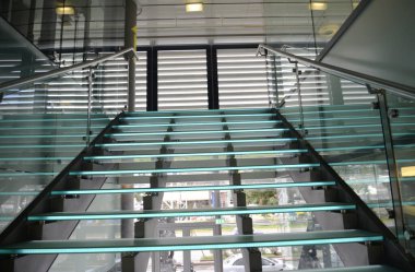 beautiful glass architectural staircase inside the building