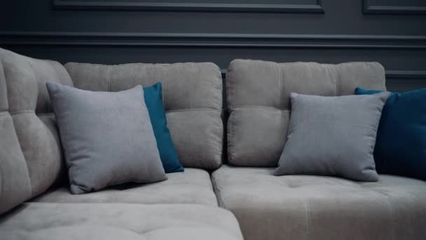 Slow Shot Gray Couch Two Gray Two Blue Pillows Video — Wideo stockowe