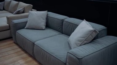 Blue sofa with gray cushions, slow shot from above. 4k video