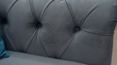 Close-up of a comfortable gray sofa. 4k video