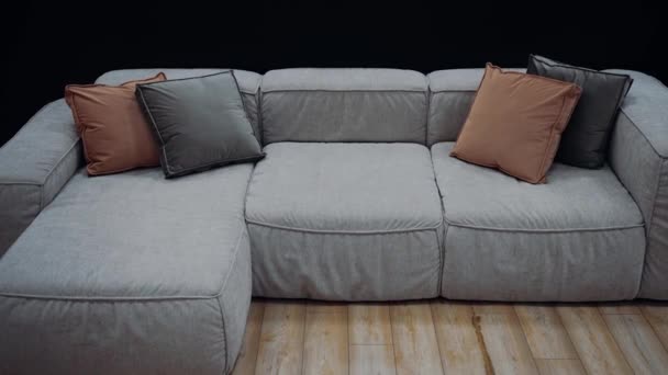 Gray Sofa Brown Dark Gray Cushions Dark Background — Video Stock